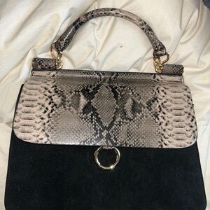 Black and snake skin handbag